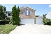 Charming two-story brick home with a two car garage and well-maintained landscaping at 5652 Apple Branch Way, Indianapolis, IN 46237