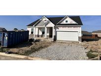 New construction home featuring a two-car garage and a partially graveled driveway at 9417 Crimson Cir, Lapel, IN 46051