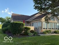 Attractive home exterior with brick and manicured lawn at 11503 Winding Wood Dr, Indianapolis, IN 46235