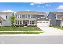 Beautiful two-story home featuring a spacious two-car garage, a well-maintained lawn, and professionally designed landscaping at 3980 Canning St, Danville, IN 46122