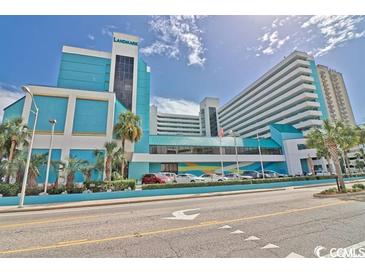 The Landmark Resort featuring vibrant turquoise and white facade against a bright blue sky at 1501 Ocean Blvd. S # 714, Myrtle Beach, SC 29577