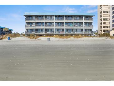 Oceanfront condo building featuring multiple floors of units with balconies and lovely beach views at 6000 N Ocean Blvd. # 131, North Myrtle Beach, SC 29582