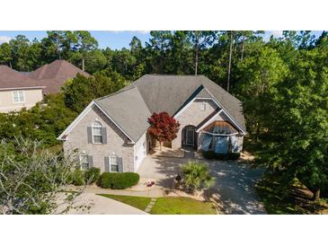 Beautiful home featuring brick exterior, gray roof, and well-manicured lawn at 2000 Kilkee Dr., Myrtle Beach, SC 29579