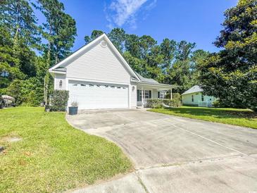 Charming home featuring an attached two car garage and traditional front porch at 412 Callie Dr., Myrtle Beach, SC 29588