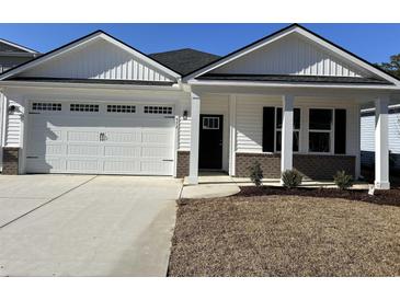 Newly constructed home with a two-car garage and attractive landscaping at 573 Beckham Ct., Murrells Inlet, SC 29576