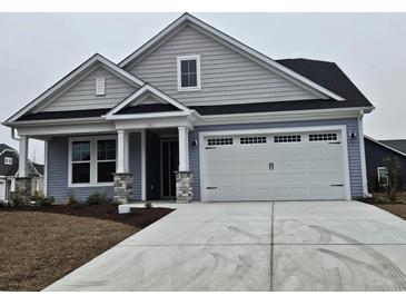 Charming single-Gathering home with a two-car garage and stylish exterior at 5001 Cambria Ct., Little River, SC 29566