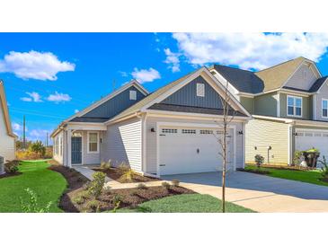 New construction home with gray and white exterior, two-car garage, and landscaped lawn at 622 Castle Ct., Myrtle Beach, SC 29579