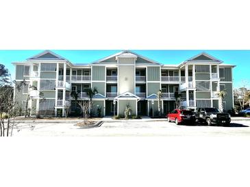 Two-story apartment building with light green exterior and balconies at 35 Delray Dr. # 1-E, Murrells Inlet, SC 29576
