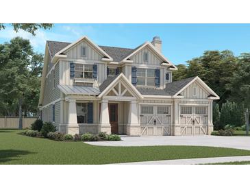 Two-story house with gray siding, white trim, and a two-car garage at 405 N Highland Way, Myrtle Beach, SC 29572