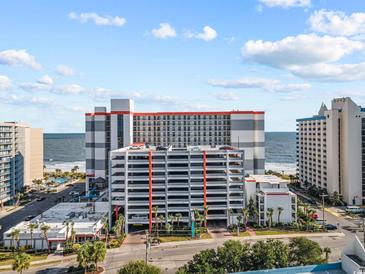 Coastal high-rise resort building with a multi-level parking deck and distant views of the ocean at 7200 Ocean Blvd. N # 254, Myrtle Beach, SC 29572