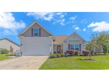 Charming single-Gathering home with a well-manicured lawn, attached garage, and neutral colored siding at 3412 Holly Loop, Conway, SC 29527