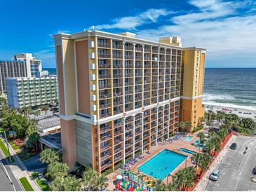 Stunning aerial view of the beachfront high-rise featuring multiple balconies and a pool area at 6900 N Ocean Blvd. # 405, Myrtle Beach, SC 29572