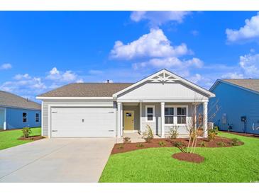 Charming single-story home with a manicured lawn, attached garage, and inviting front porch at 3046 Deerberry Place, Longs, SC 29568