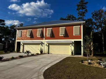 Two-unit building with attached garages, and landscaped yards at 110 Hallandale Lane # Right, Murrells Inlet, SC 29576