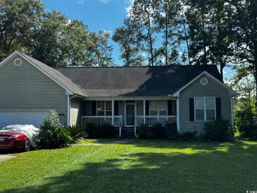 Charming single-story home with a well-maintained lawn and a welcoming front porch at 78 Joys Pl., Andrews, SC 29510