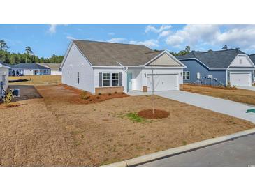 Charming single-story home with white siding, a two-car garage, and manicured front yard at 329 Palmetto Sand Loop, Conway, SC 29527