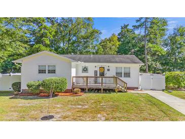 Charming white house with a deck and well-manicured lawn at 1412 Hemingway St., Myrtle Beach, SC 29577