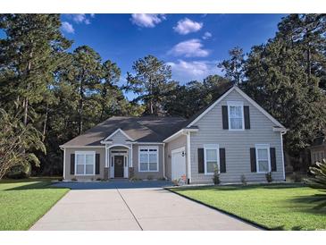 Charming single-Gathering home featuring a manicured lawn and a cozy exterior design with neutral tones and black shutters at 323 Trestle Way, Conway, SC 29526