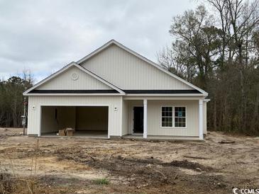 Newly constructed home with vinyl siding and a covered porch at 3162 Wayside Rd., Conway, SC 29527