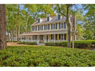 Charming two-story home featuring a wide front porch and traditional design at 3034 Oak Grove Bend # 34 Ar, Murrells Inlet, SC 29576