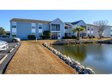 Exterior view of condo building with water view at 2257 Essex Dr. # E, Surfside Beach, SC 29575