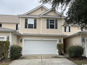 Charming two-story home with a two-car garage and well-maintained landscaping at 1060 Fairway Ln. # 1060, Conway, SC 29526