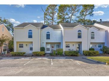 Three-unit townhouse building with parking and landscaping at 6703 Jefferson Pl. # B2, Myrtle Beach, SC 29572