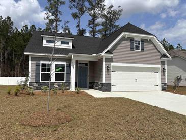 Charming single-Gathering home featuring stone accents, a two-car garage, and welcoming front yard at 300 Palmetto Sand Loop, Conway, SC 29527