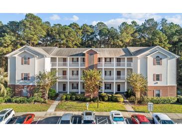 Multi-Gathering building featuring three stories, traditional architectural details, and multiple balconies at 4818 Innisbrook Ct. # 603, Myrtle Beach, SC 29579