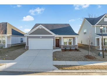 Charming single-story home featuring a covered entryway, garage, and a well-manicured lawn at 2472 Campton Loop, Conway, SC 29527