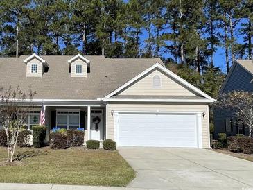 Charming one-story home with a two-car garage and well-maintained landscaping at 620 Sunnyside Dr. # 102, Murrells Inlet, SC 29576