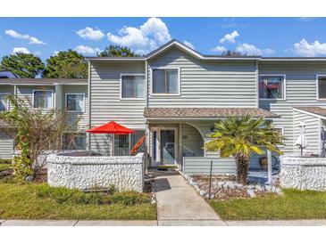 Charming two-story townhome with a cozy front patio and well-maintained landscaping, offering a welcoming curb appeal at 86 Shadow Moss Pl. # 86, North Myrtle Beach, SC 29582