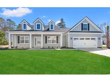 Charming single-Gathering home with a manicured lawn and a two-car garage at 1101 Anne St., North Myrtle Beach, SC 29582