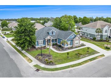 Beautiful single-story home with a well-manicured lawn and landscaping in a desirable community at 1201 Surf Pointe Dr., North Myrtle Beach, SC 29582