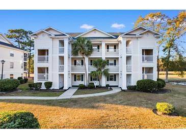 Inviting 3-story building with ample parking and landscaping at 597 Blue River Ct. # 2F, Myrtle Beach, SC 29579
