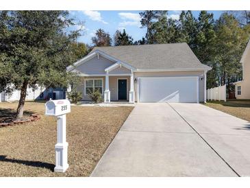 Two-story house with attached garage and driveway at 255 Sea Turtle Dr., Myrtle Beach, SC 29588