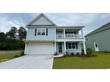 Charming two-story home featuring a welcoming front porch and attached garage at 6056 Forest Dell Ct, Myrtle Beach, SC 29579