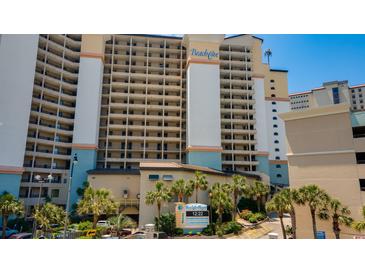 Spacious multi-story resort building with balconies, palm trees, and well-maintained landscaping at 4800 S Ocean Blvd. # 920, North Myrtle Beach, SC 29582