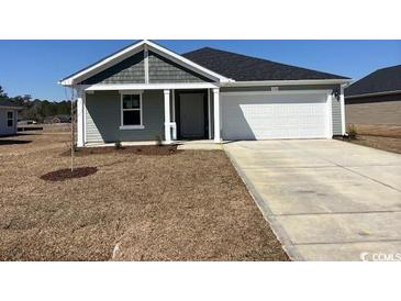 Charming single-story home featuring a two-car garage and a well-maintained lawn at 1522 Clubstone Dr., Conway, SC 29526