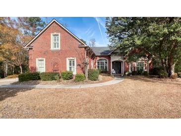 Brick home with landscaped yard and walkway at 487 Trestle Way, Conway, SC 29526