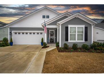 Gray and white two-story house with a two-car garage and landscaping at 2548 Brescia St., Myrtle Beach, SC 29579