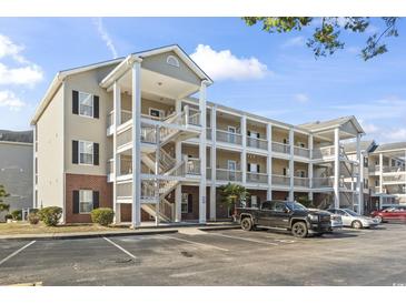 Two-story condo building with parking and balconies at 1058 Sea Mountain Hwy. # 11-303, North Myrtle Beach, SC 29582