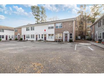 Charming multi-Gathering home featuring a spacious parking lot and well-maintained landscaping at 6706 Bryant St. # B, Myrtle Beach, SC 29572