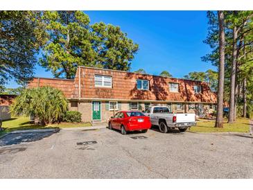 Front view of a townhouse with brick and brown roof at 1025 Carolina Rd. # Z4, Conway, SC 29526