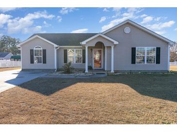 Charming single-story home with a well-maintained lawn and inviting entryway at 1049 Augustus Dr., Conway, SC 29527