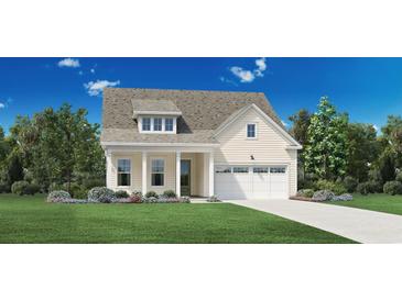 Cream exterior house with a two-car garage and landscaped front yard at 3027 Reamer Dr., Murrells Inlet, SC 29576