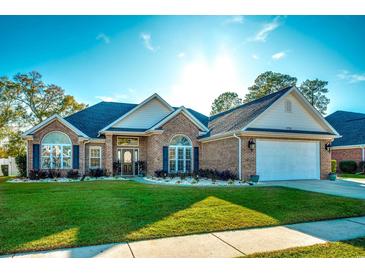 Brick home with landscaped lawn and two-car garage at 3750 Kingsley Dr., Myrtle Beach, SC 29588