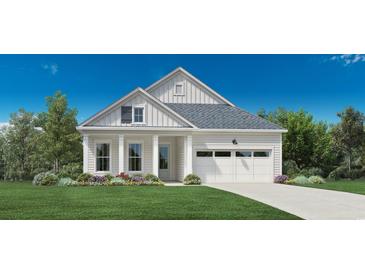 Craftsman style home with two-car garage and landscaped front yard at 5035 Whitsett St., Murrells Inlet, SC 29576