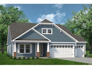 Two-story craftsman style home with gray siding, white trim, and a two-car garage at 767 St. Vincent Loop, Little River, SC 29566