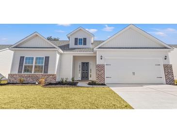 Charming single-Gathering home featuring gray accents, attached garage, and a well-manicured lawn at 391 Lifestyle Court, Surfside Beach, SC 29575